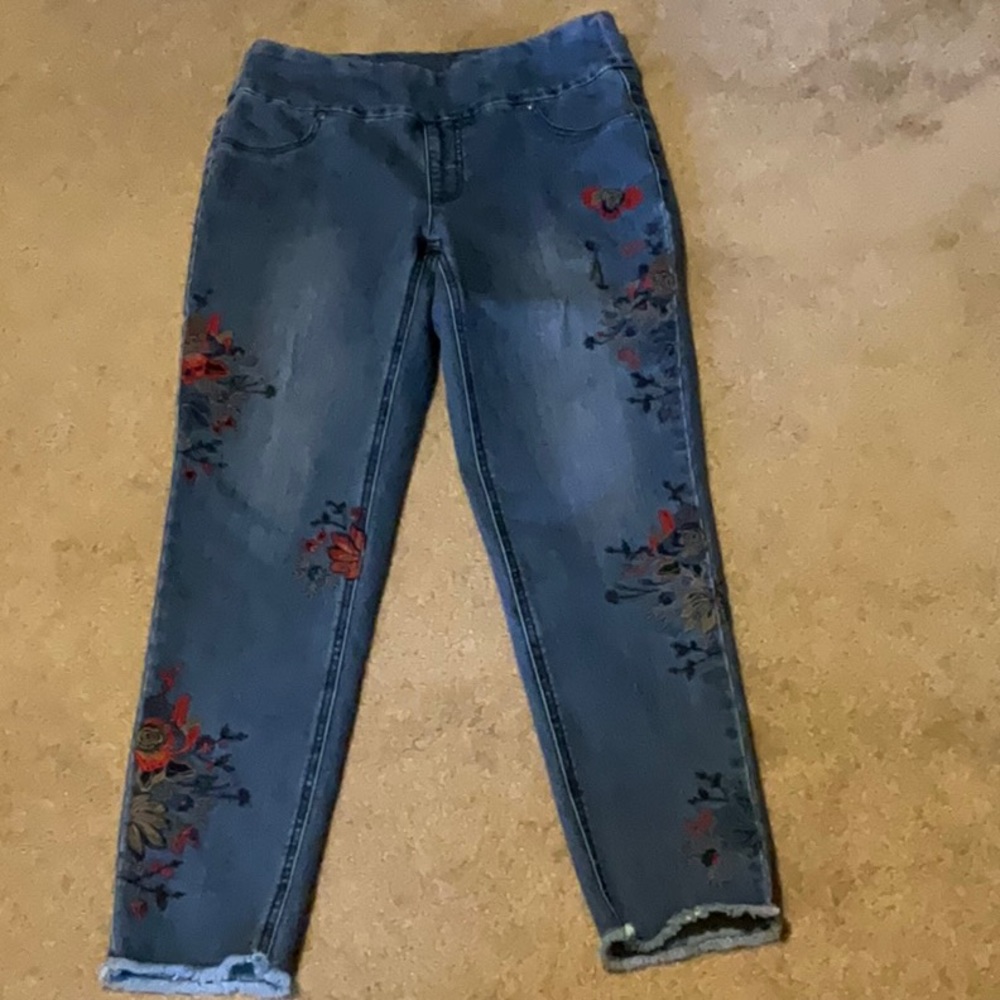 Jeans, embroidery on legs/back pocket. Skinny type pull on with 2% spandex